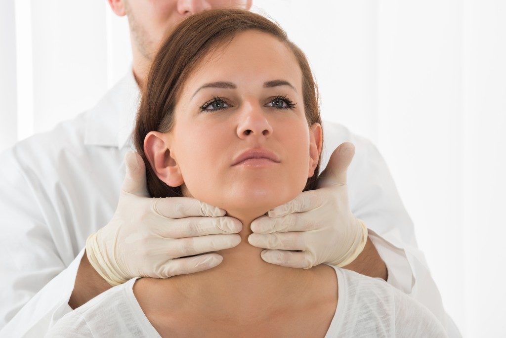 Patient having her thyroid checked