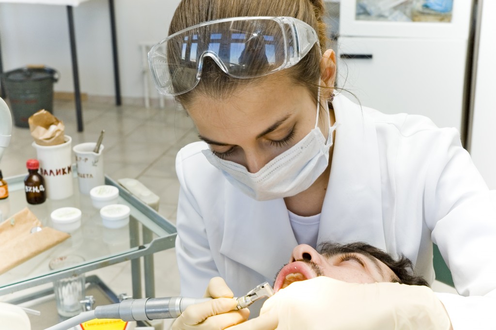 dentist cleaning teeth