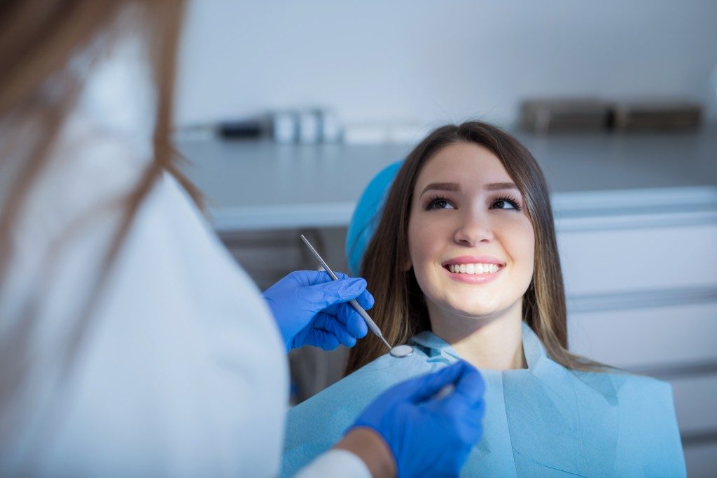 girl smiling at her dentist