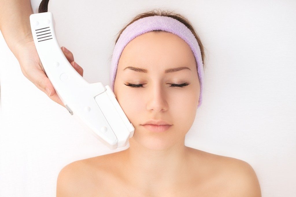 woman getting a laser hair removal