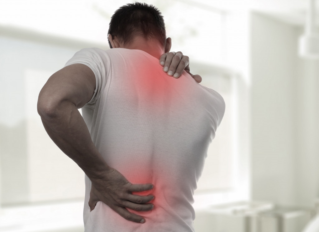Man having upper and lower back pain