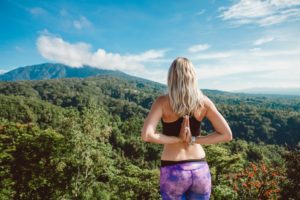 woman meditating in the mountains