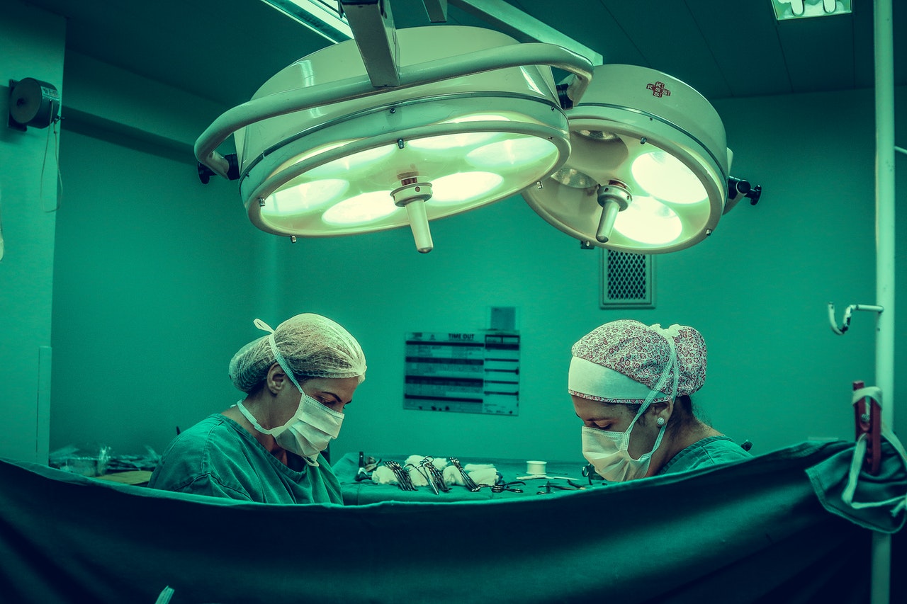 doctors in operating room performing surgery
