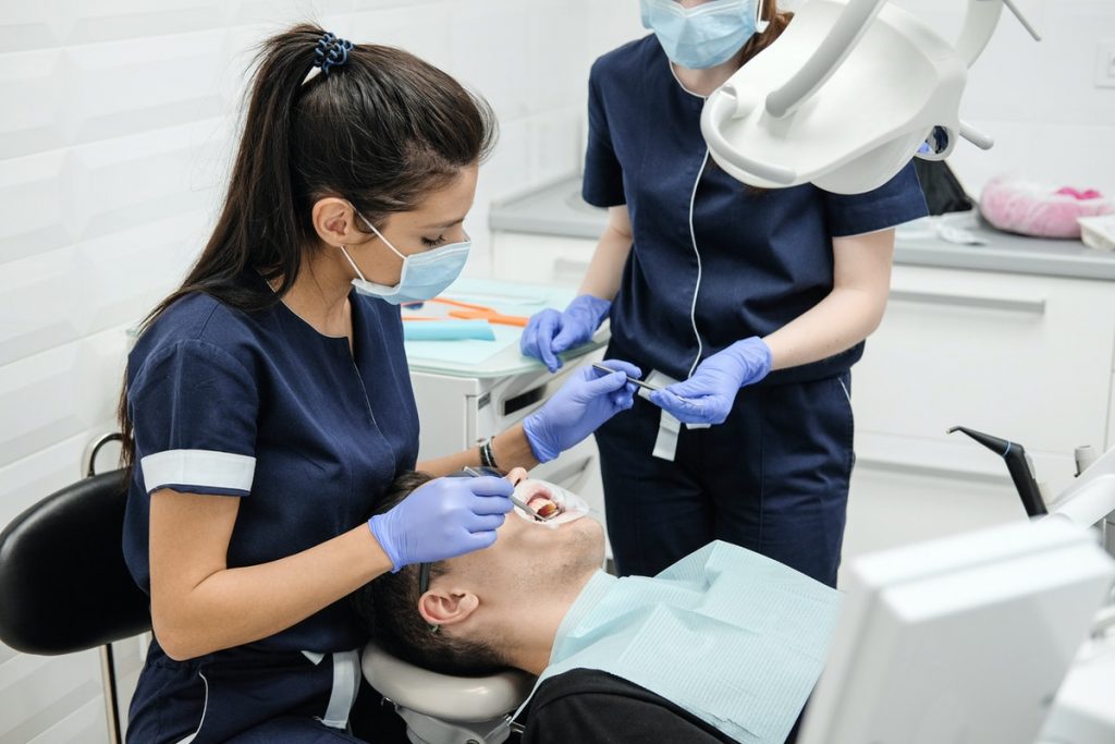 dentist with assistant