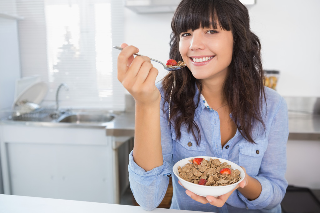 Woman eating healthy at home