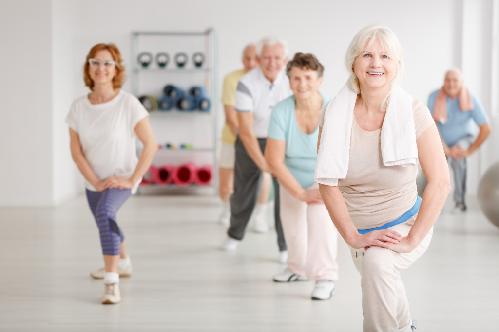 gourp of seniors exercising in the gym
