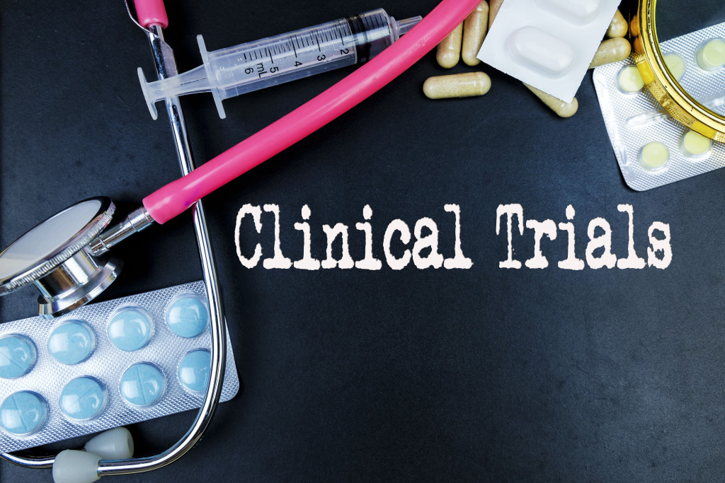 clinical trials concept with stethoscope and syringe